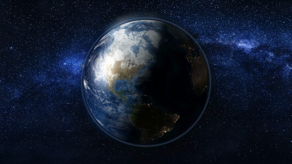 Planet Earth in black and blue Universe of stars
